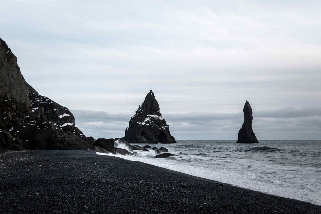 A dark and gloomy Reynisfjara black sand beach in South Iceland